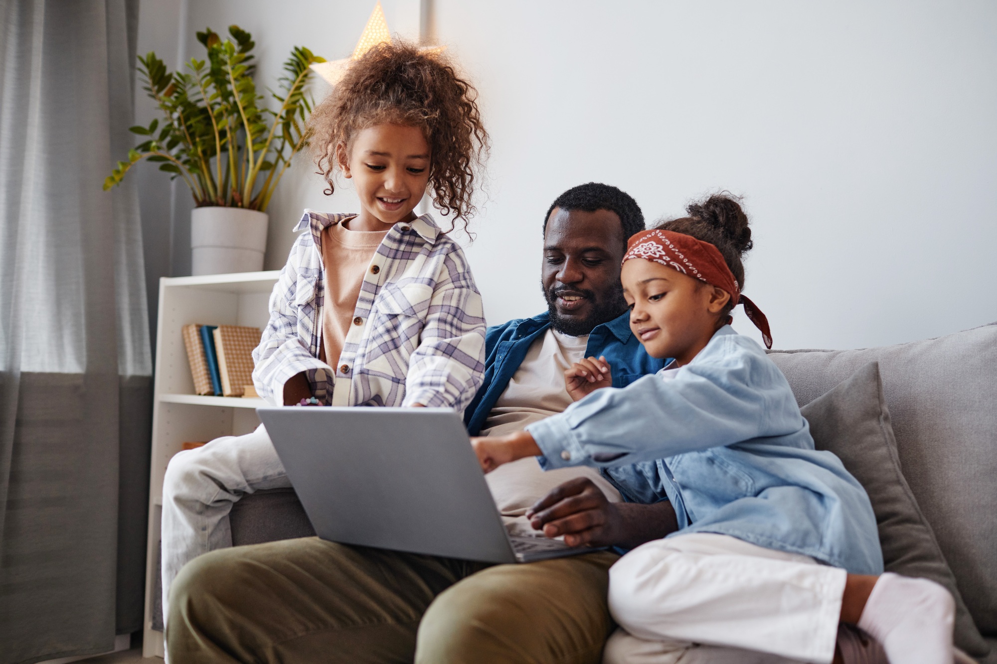 African American Man with Daughters