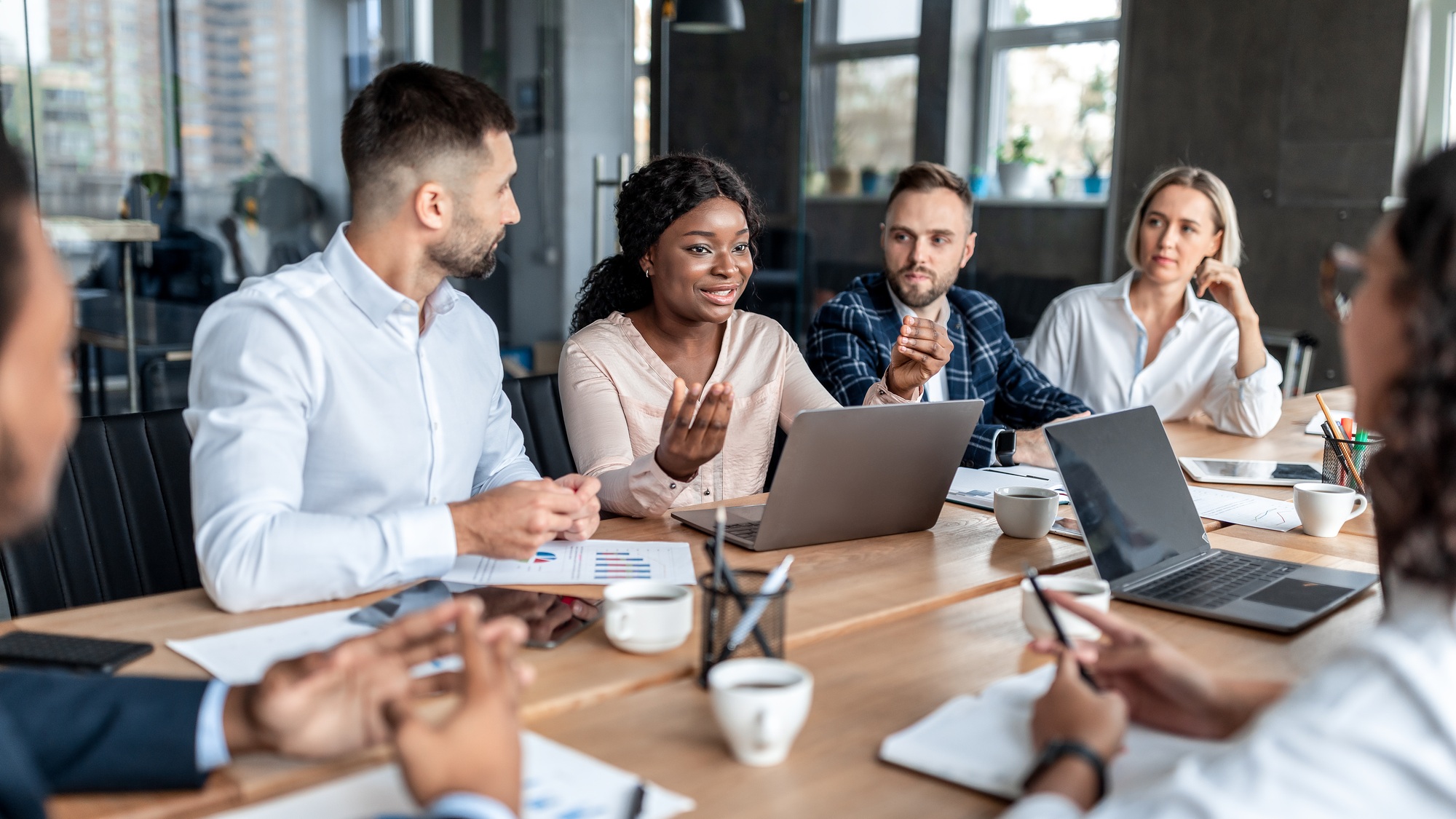 African Businesswoman Talking With Coworkers On Business Meeting In Office